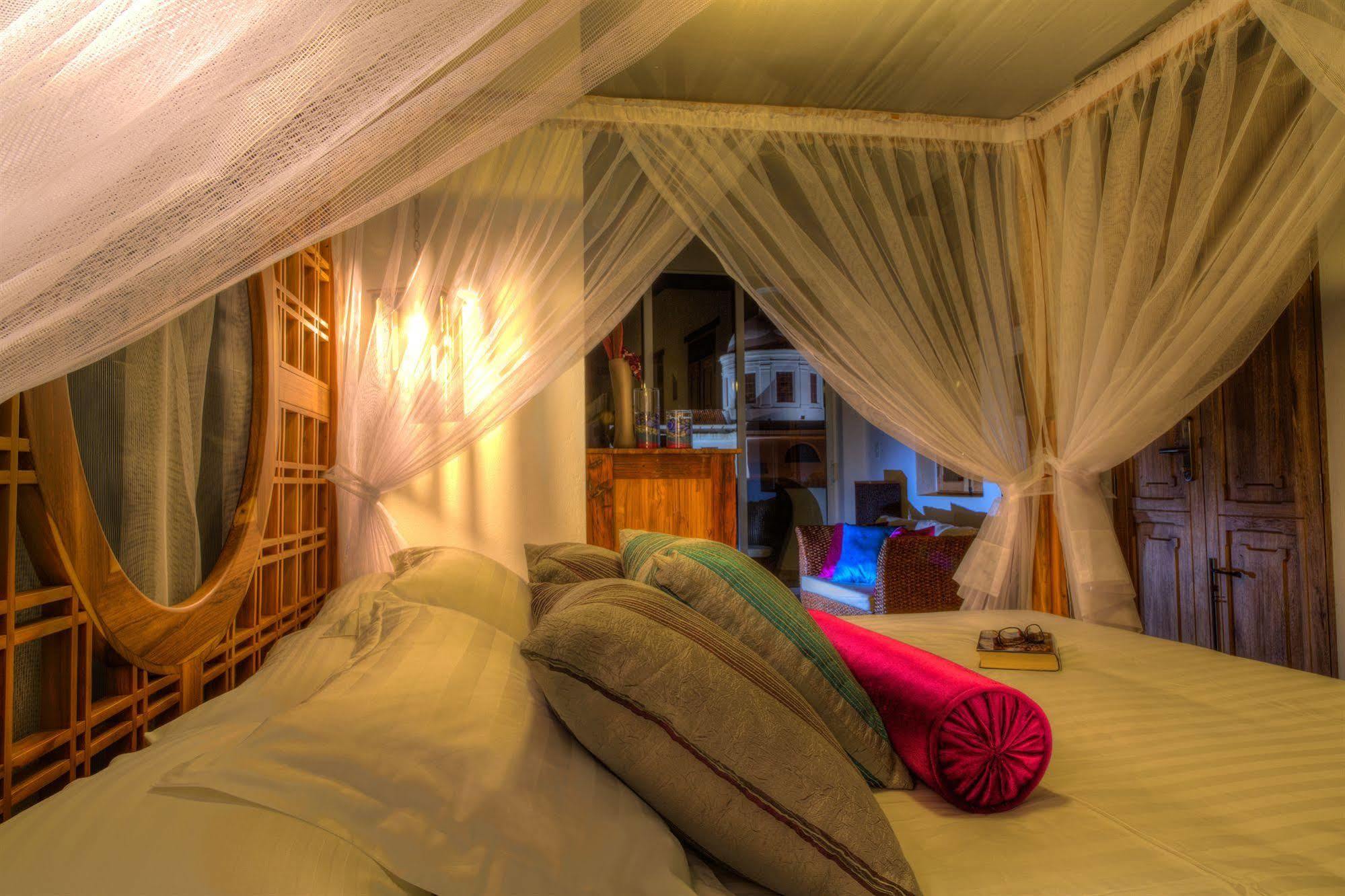 Casa de Leda, a Kali Hotel Santa Marta  Luaran gambar A mosquito net over a bed