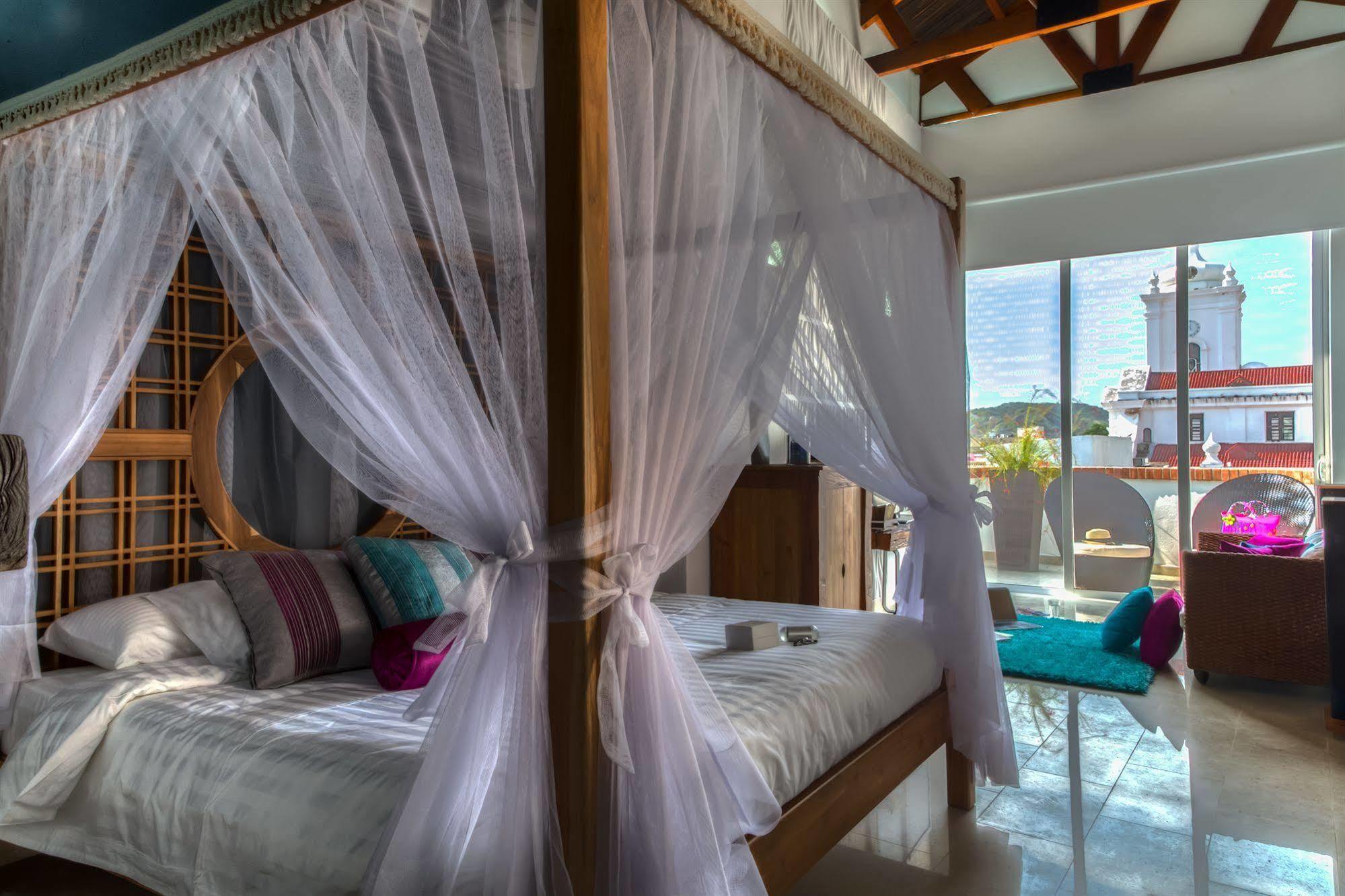 Casa de Leda, a Kali Hotel Santa Marta  Luaran gambar A canopy bed